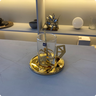 xicara origami media com pires e mexedor inox revestido em ouro 24k riva 5